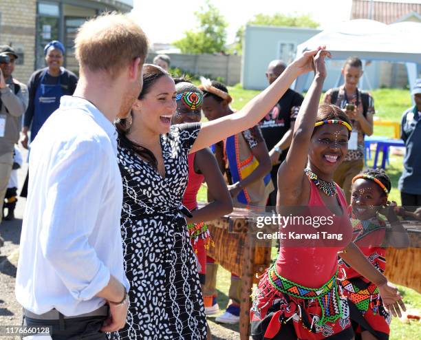 Prince Harry, Duke of Sussex and Meghan, Duchess of Sussex visit the Nyanga Township during their royal tour of South Africa on September 23, 2019 in...