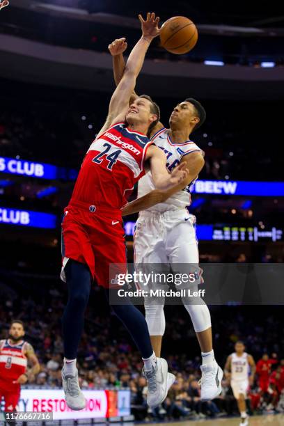 Zhaire Smith of the Philadelphia 76ers fouls Garrison Mathews of the Washington Wizards in the fourth quarter of the preseason game at the Wells...