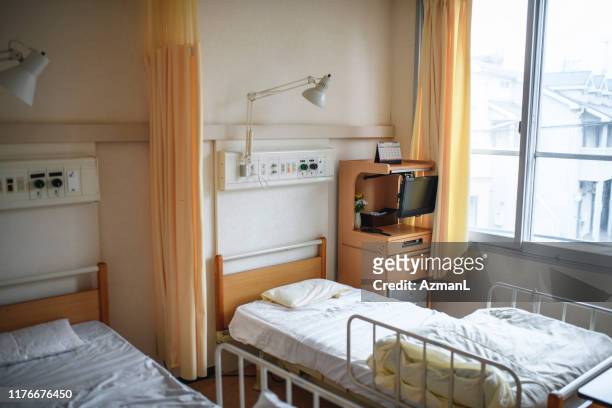 high angle view of empty tokyo hospital beds - railing stock pictures, royalty-free photos & images