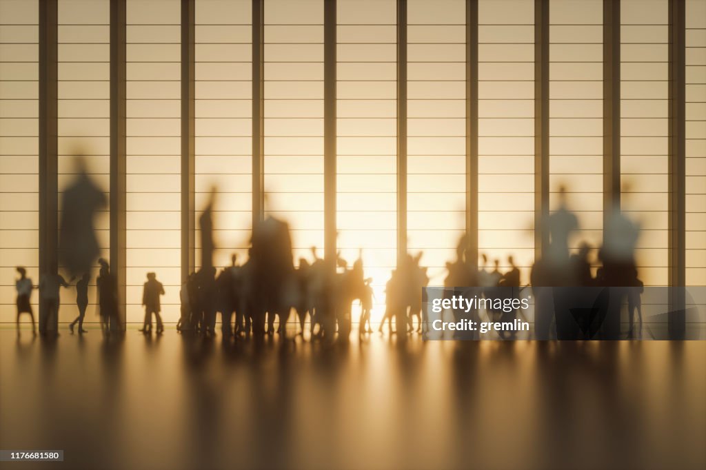 Group of people against modern glass facade
