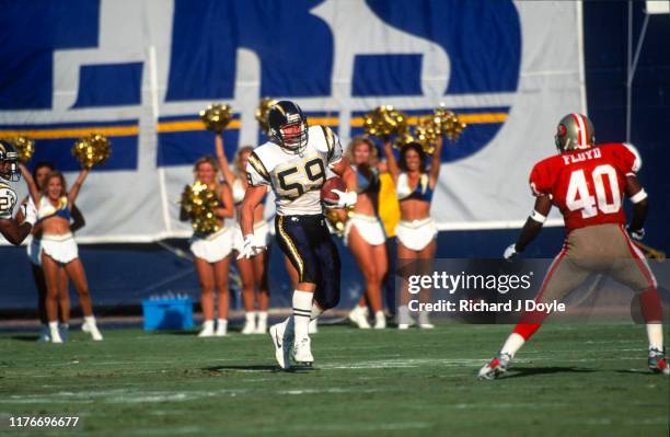 49ers FB William Floyd sizing up S. D. Chargers - LB Glen Young who just intercepted a pass. San Francisco 49ers 17 vs San Diego Chargers 6 at Jack...