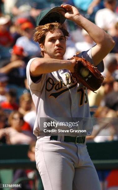 Barry Zito of the A's wipes his brow after giving up a single in the seventh inning losing his bid for a no-hitter.