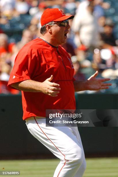 Angel Manager Mike Scioscia runs onto the field to dispute a play in the sixth inning.