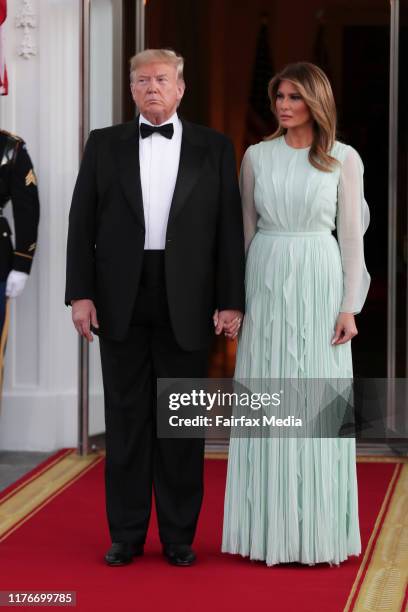 President Donald Trump and First Lady Melania Trump wait for the arrival of Australian Prime Minister Scott Morrison and his wife, Jenny Morrison,...