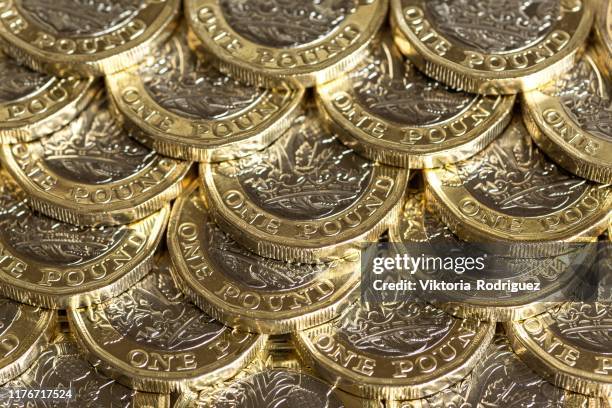 british one pound coins - pound coins stock pictures, royalty-free photos & images