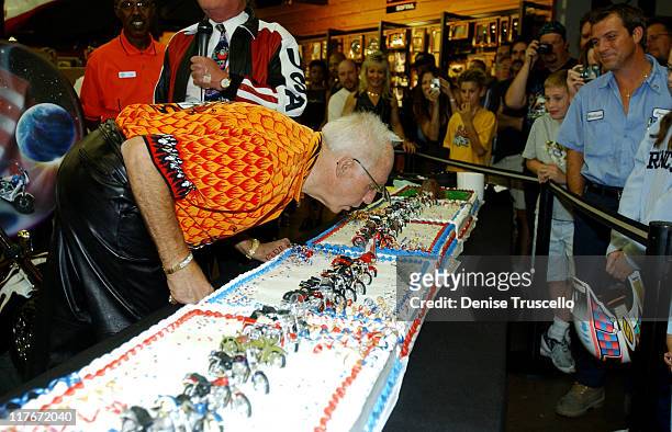 Evel Knievel blows out the candles at his 64th birthday celebration on October 17, 2002 in Las Vegas.