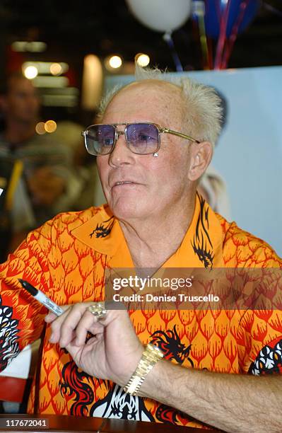 Evel Knievel signs autographs at his 64th birthday celebration on October 17, 2002 in Las Vegas.