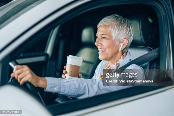 businesswoman on the move - motorheadphones stock pictures, royalty-free photos & images
