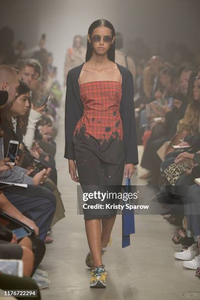 Model walks the runway during the ROKH Womenswear Spring/Summer 2020 show as part of Paris Fashion Week on September 23, 2019 in Paris, France.