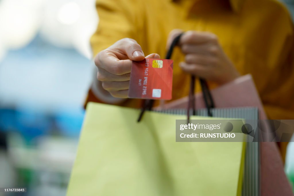 Woman paying with credit card