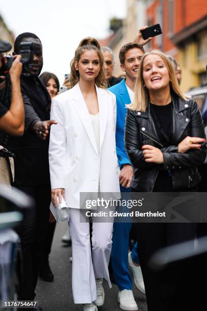 Barbara Palvin wears a white jacket, outside the Boss show during Milan Fashion Week Spring/Summer 2020 on September 22, 2019 in Milan, Italy.