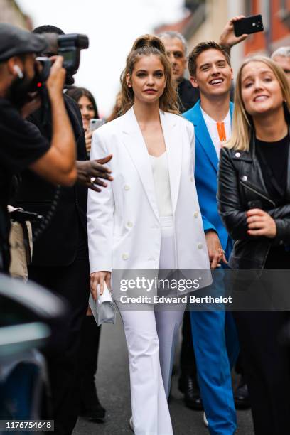 Barbara Palvin wears a white jacket, outside the Boss show during Milan Fashion Week Spring/Summer 2020 on September 22, 2019 in Milan, Italy.