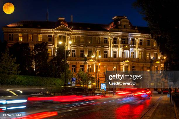 grand hotel kempinski by night in vilnius, lithuania - lithuania stock pictures, royalty-free photos & images