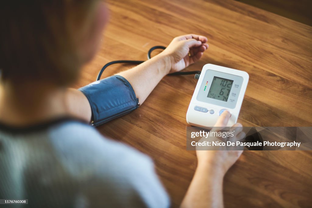 Woman checking blood pressure