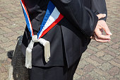 french mayor tricolor scarf during a celebration in France