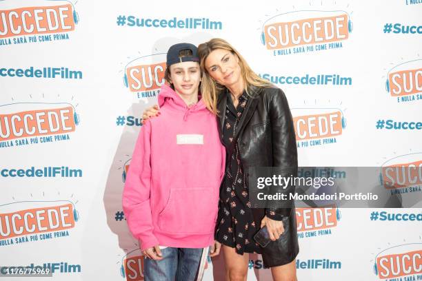 Italian tv-host and model Martina Colombari with her son Achille Costacurta attend the premier of movie Succede, by Sofia Viscardi's book, at Odeon...