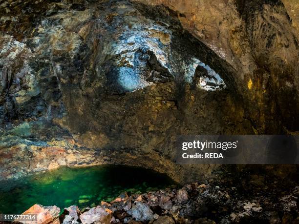 Algar do Carvao. A volcanic vent and landmark of the island. The lake in the cave. Island Ilhas Terceira. Part of the Azores in the atlantic ocean....