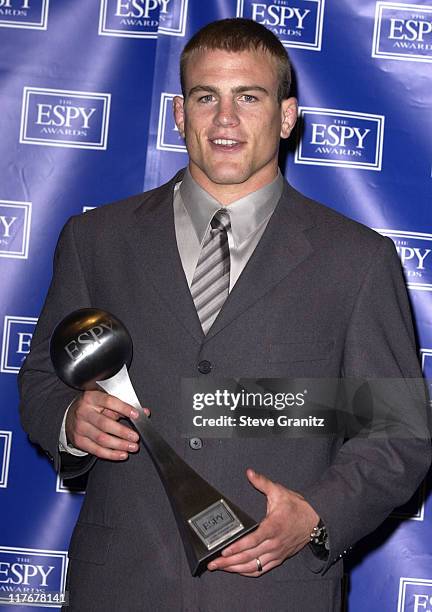 Cael Sanderson holds his 2002 ESPY Award for Best Male College Athlete. Cael has a 159-0 wrestling career record.