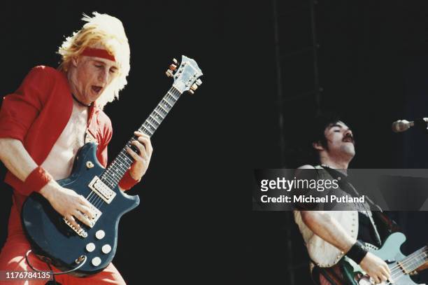 Guitarist Dave 'Sniffa' Bryce and bassist Brian Burrows of British heavy metal group Spider perform live on stage at the Reading Festival in Reading,...