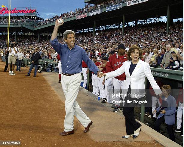 Democratic presidential hopeful John Kerry and his wife Teresa Heinz Kerry walk on to the field at Fenway Park in Boston, as the Boston Red Sox host...