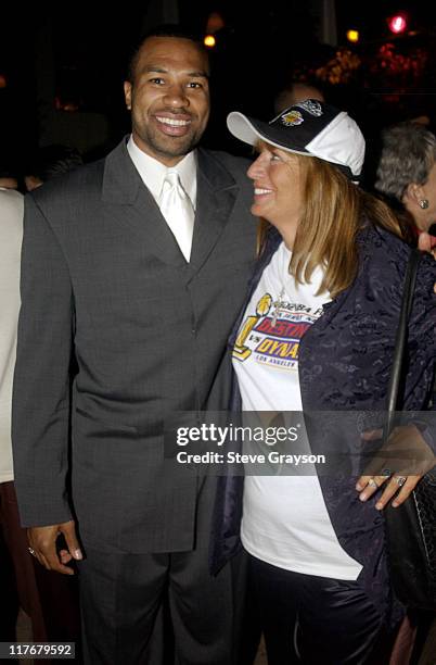 Derek Fisher & Penny Marshall pose for photographers at the Los Angeles Lakers victory celebration at Ian Schrager's Ultra Chic Mondrian Hotel.
