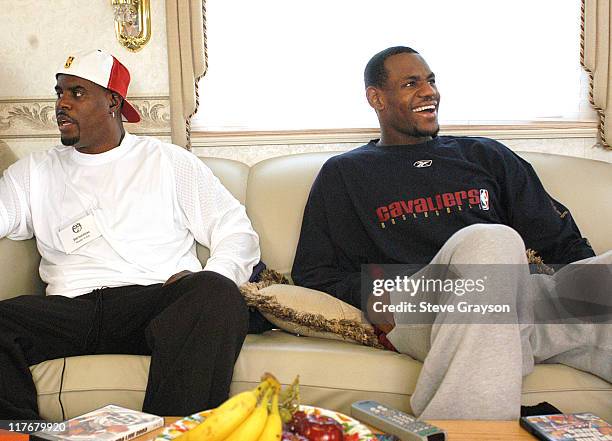 LeBron James, right, with his agent Aaron Goodwin at the Great Western Forum to film a commercial after two exhibition games in Los Angeles.