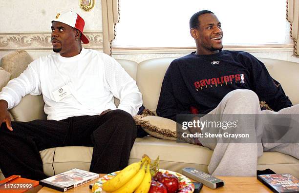 LeBron James, right, with his agent Aaron Goodwin at the Great Western Forum to film a commercial after two exhibition games in Los Angeles.