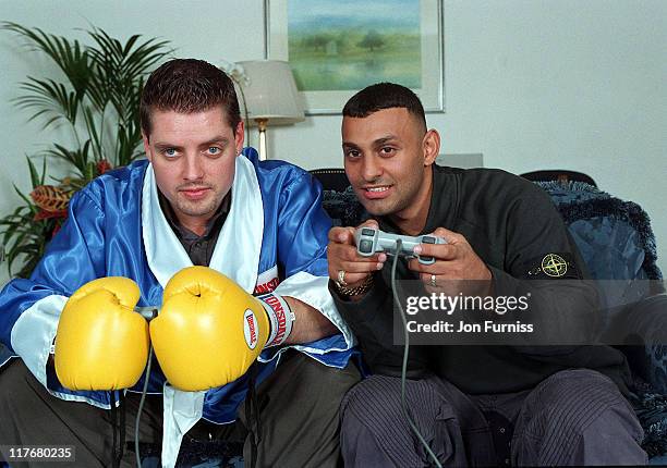 Keith Duffy and Naseem Hamed during Keith Duffy and Naseem Hamed Promote New Boxing Game On Playstation at London in London, Great Britain.