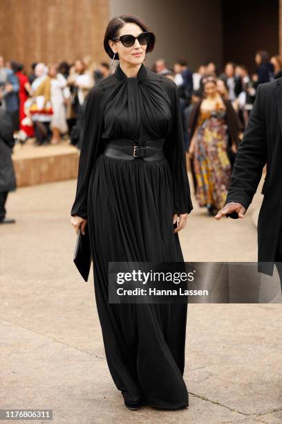 Monica Bellucci wearing black sheer maxi dress outside Dior on September 24, 2019 in Paris, France.