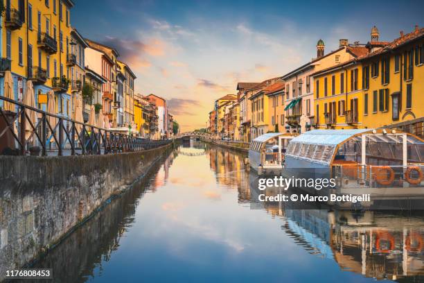 navigli canals in the old town at sunset, milan, italy - milão imagens e fotografias de stock