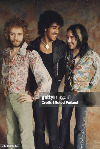 From left, guitarist Eric Bell, bassist and singer Phil Lynott and drummer Brian Downey of Irish rock group Thin Lizzy posed together on 15th...