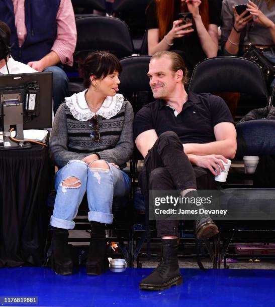 Lily Allen and David Harbour attend New York Knicks v New Orleans Pelicans preseason game at Madison Square Garden on October 18, 2019 in New York...