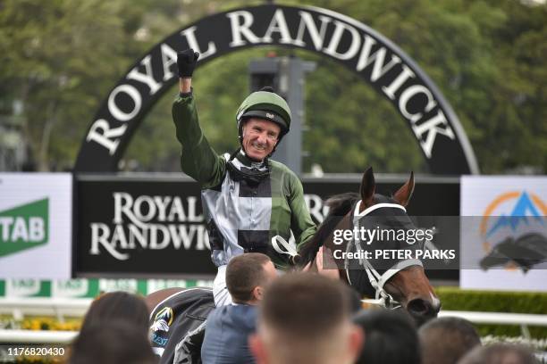 Jockey Glen Boss celebrates on Yes Yes Yes after winning the Everest 2019 horse race at the Royal Randwick race course in Sydney on October 19, 2019....