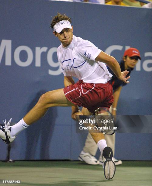 Andy Roddick pulls out all the stops, hitting shots from all over the court to win over Juan Ignacio Chela, 5-7, 6-4, 6-4, 6-4.