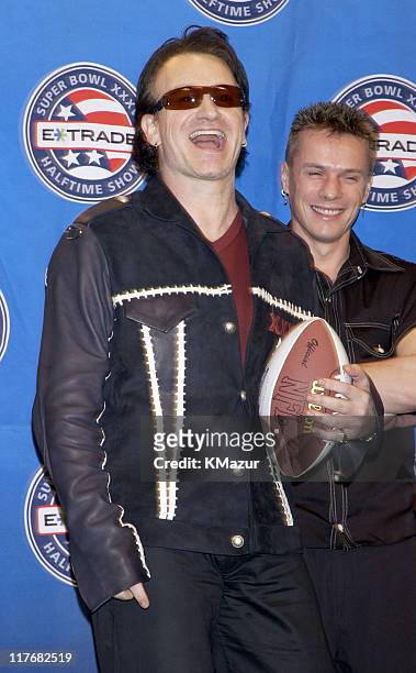 Bono and drummer Larry Mullen Jr. Of U2 attend a press conference January 30, 2002 at the Superdome in New Orleans, Louisiana, days before their live...