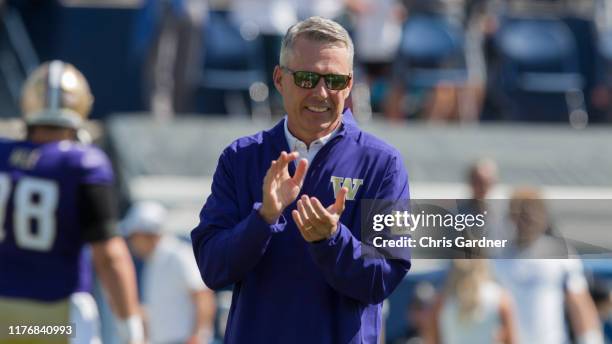 Head coach Chris Petersen of the Washington Huskies claps during warmups before their game against the BYU Cougars at LaVell Edwards Stadium on...