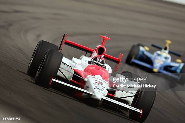 Driver Helio Castroneves practices for the Indy 500 at the Indianapolis Motor Speedway on May 11, 2005