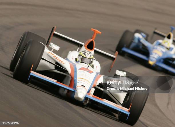 Driver Jacques Lazier leaves a trail of sparks during practice for the Indy 500 at the Indianapolis Motor Speedway on May 11, 2005