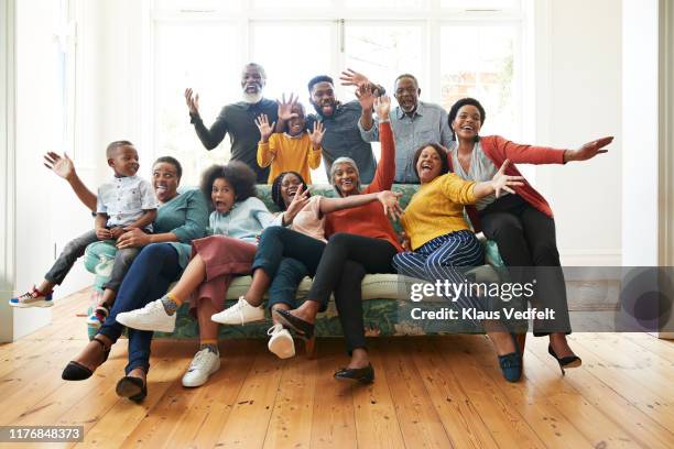 family and friends screaming on sofa at home - family portrait humor bildbanksfoton och bilder