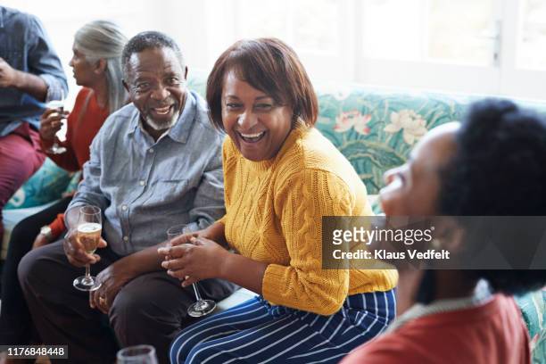 cheerful friends enjoying in social gathering - friendship men yellow stock pictures, royalty-free photos & images