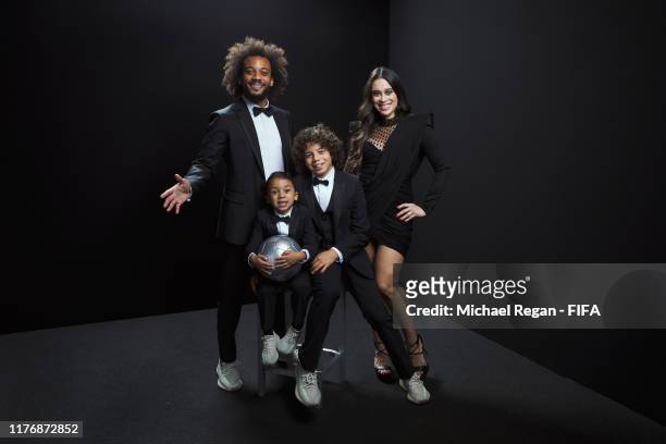 The FIFA FIFPro Men's World11 Award finalist Marcelo of Real Madrid and Brazil poses for a portrait with his wife Clarice Alves and their sons Enzo...