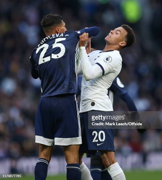 Jose Holebas of Watford and Dele Alli of Tottenham clash off the ball during the Premier League match between Tottenham Hotspur and Watford FC at...