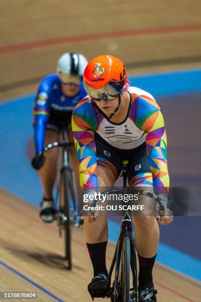 Canadian cyclist Rachel McKinnon competes against the USA's Dawn Orwick in the first race of their F35-39 Sprint Final during the 2019 UCI Track...