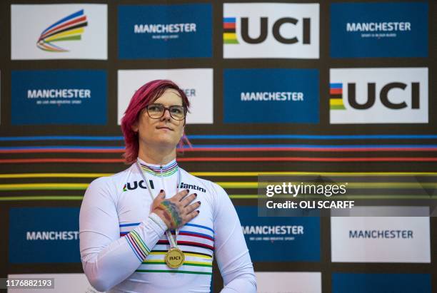 Canadian cyclist Rachel McKinnon listens to the Canadian national anthem as she celebrates her gold medal on the podium for the F35-39 Sprint...