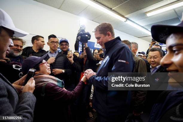 Leader of the Conservative Party of Canada Andrew Scheer greets a supporter during a campaign stop on October 19, 2019 in Toronto, Canada. Scheer...