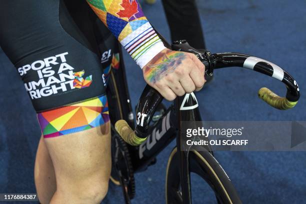 Canadian cyclist Rachel McKinnon prepares her bike before competing in the F35-39 Sprint Final during the 2019 UCI Track Cycling World Masters...