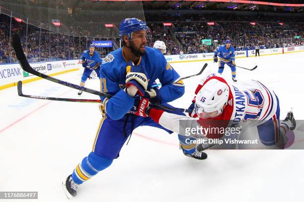 Robert Bortuzzo of the St. Louis Blues defends against Jesperi Kotkaniemi of the Montreal Canadiens at Enterprise Center on October 19, 2019 in St...