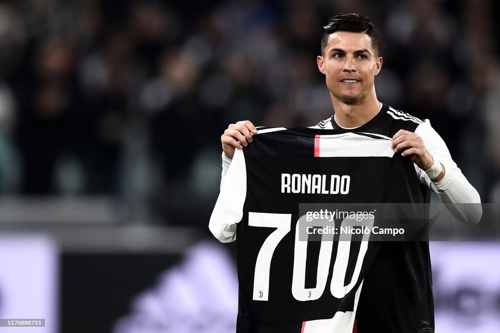 Cristiano Ronaldo of Juventus FC holds a jersey with the number 700 News  Photo - Getty Images