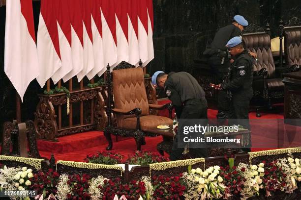 Members of the Presidential Security Force of Indonesia conduct security checks ahead of the presidential inauguration at the parliament in Jakarta,...