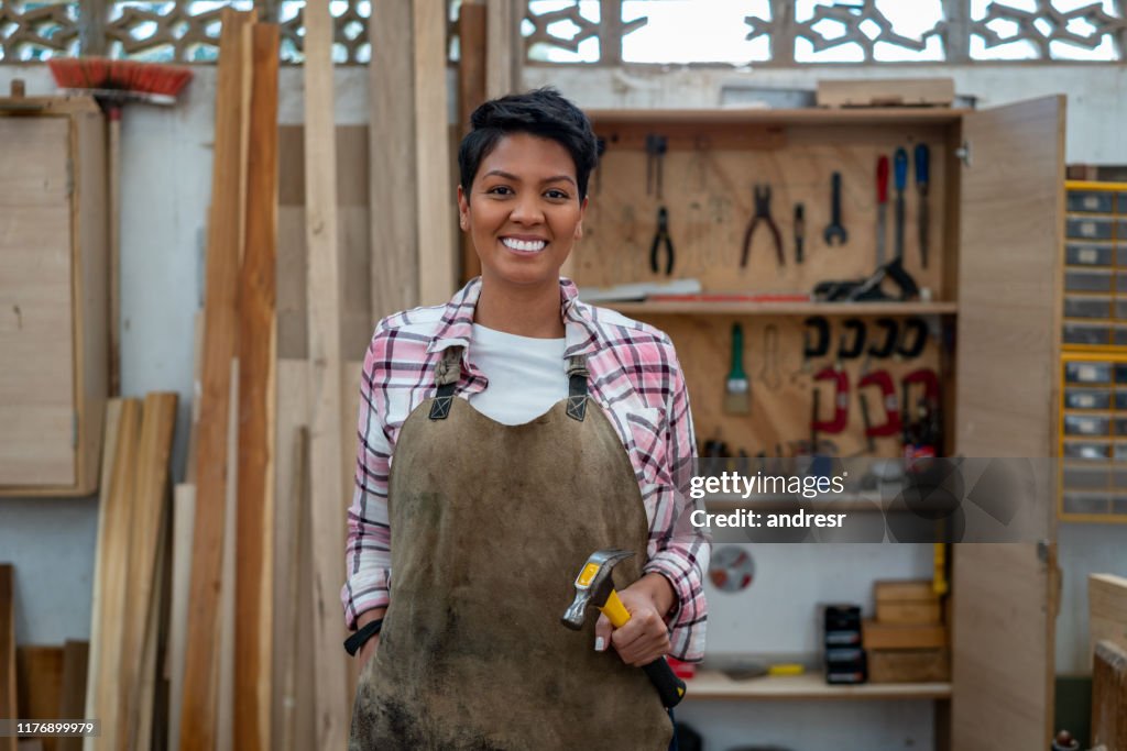 Happy Latin American carpenter smiling